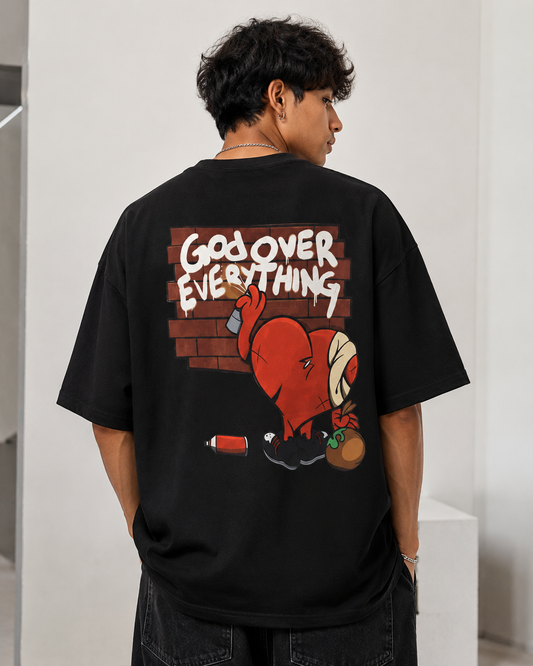Person wearing a black t-shirt with a graphic design and text on the back.