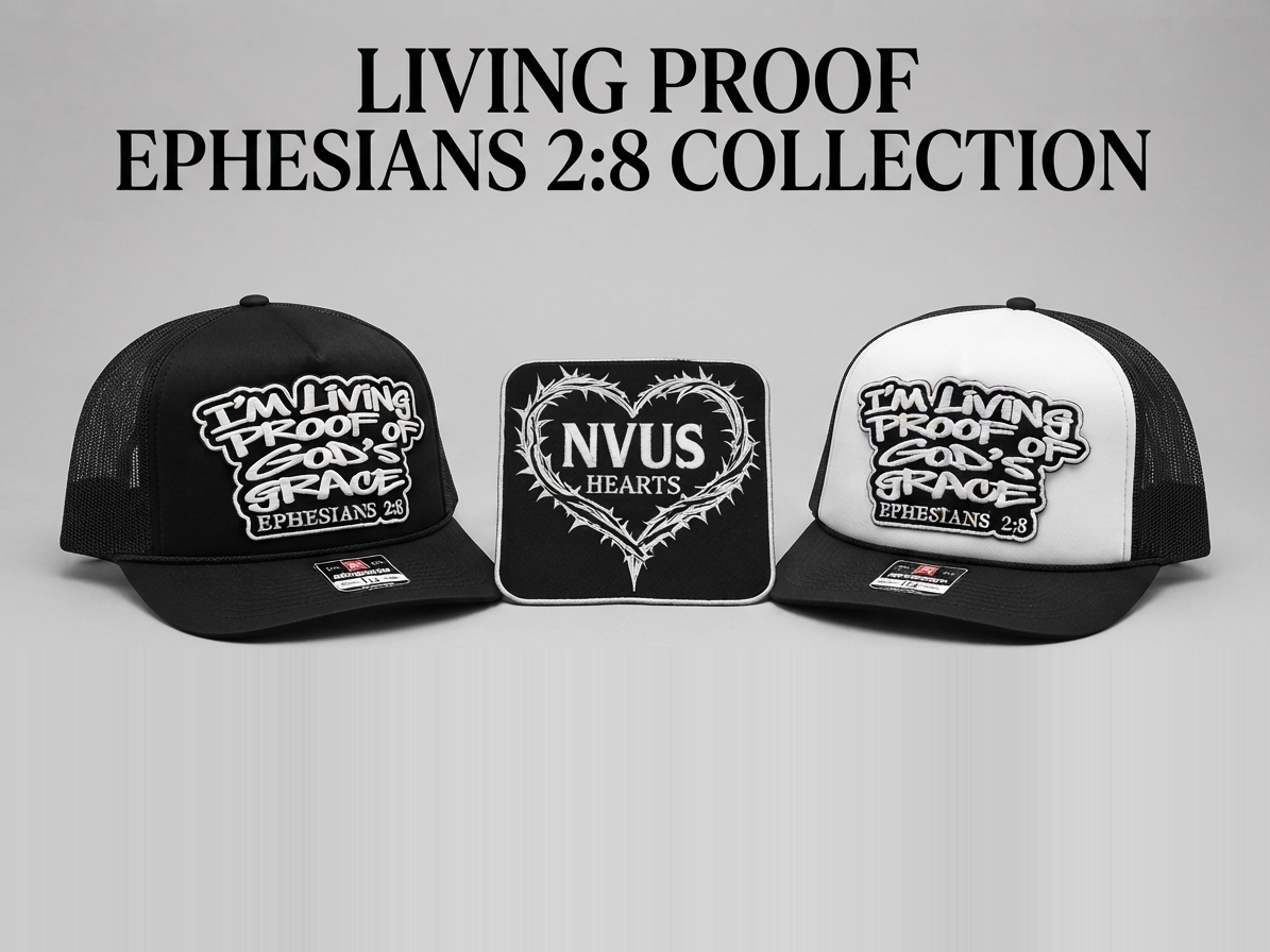 Living Proof Ephesians 2:8 Collection: the black and the black-and-white trucker hats beside the NVUS Hearts thorn-heart patch