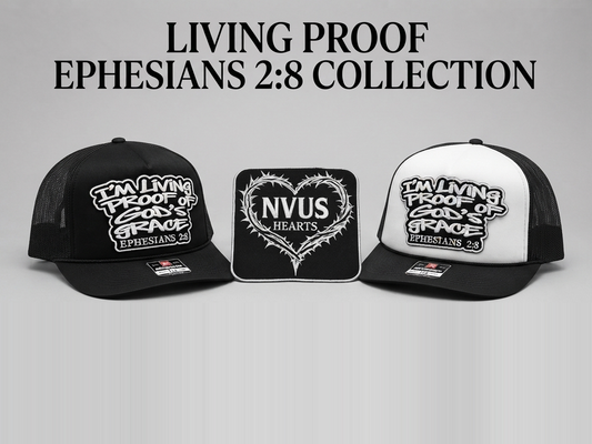 Living Proof Ephesians 2:8 Collection: the black and the black-and-white trucker hats beside the NVUS Hearts thorn-heart patch