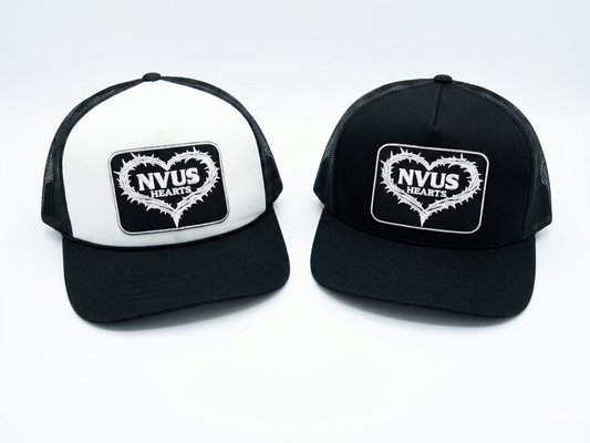 Two black and white trucker hats with a logo on a white background